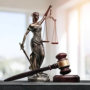scales of justice in the background with a gavel in the front