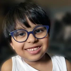 young boy wearing prescription glasses