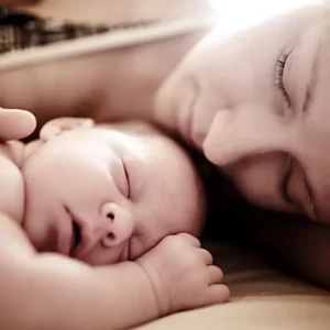 mother and newborn sleeping baby